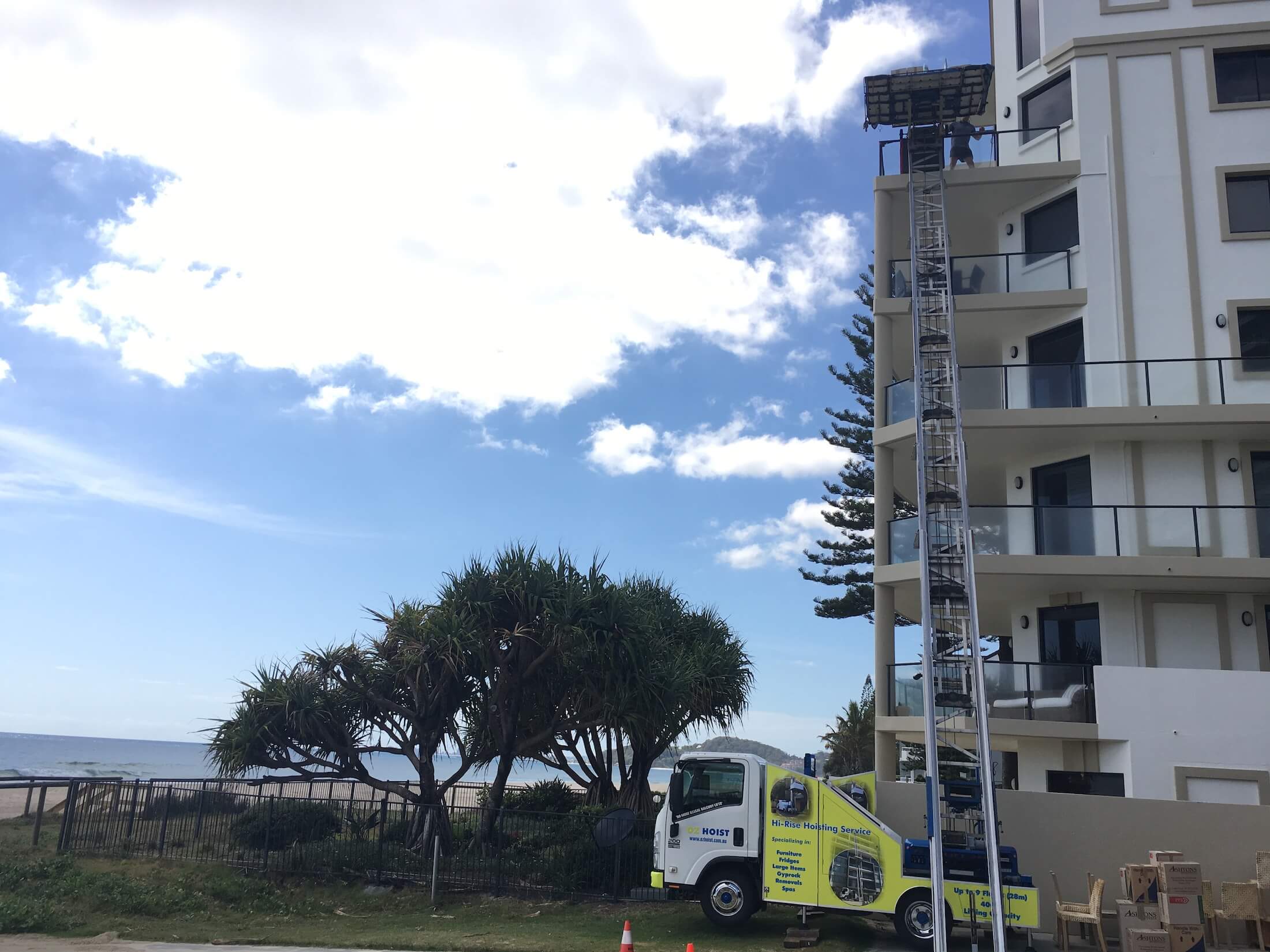 gold_coast_high_rise_apartment_lift_furniture_from_balcony_crane_hoist_lifting_up_to_9_storeys_for_units_house_townhouse gold_coast_high_rise_apartment_lift_furniture_from_balcony_crane_hoist_lifting_up_to_9_storeys_for_units_house_townhouse